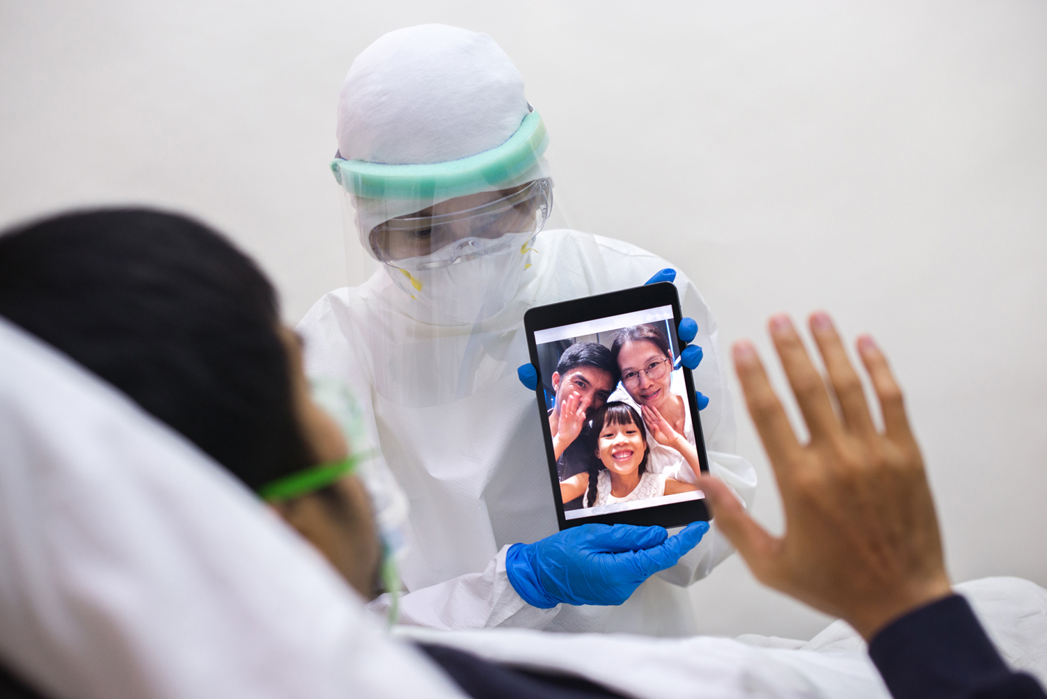 Nurse holding tablet with video call