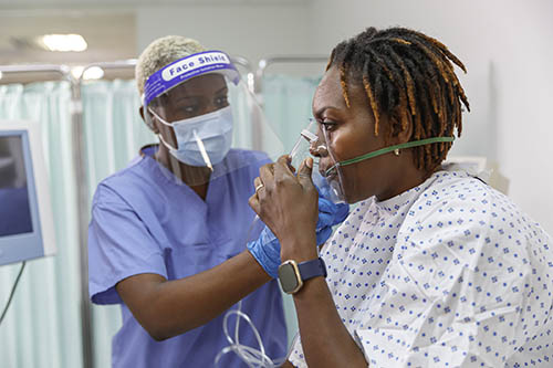 woman wearing oxygen mask